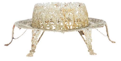 A WHITE PAINTED CAST IRON CIRCULAR TREE-TRUNK GARDEN SEAT,
