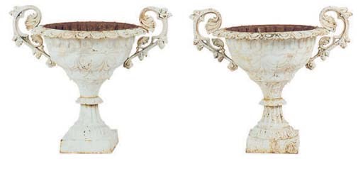 A PAIR OF WHITE PAINTED CAST IRON GARDEN URNS,