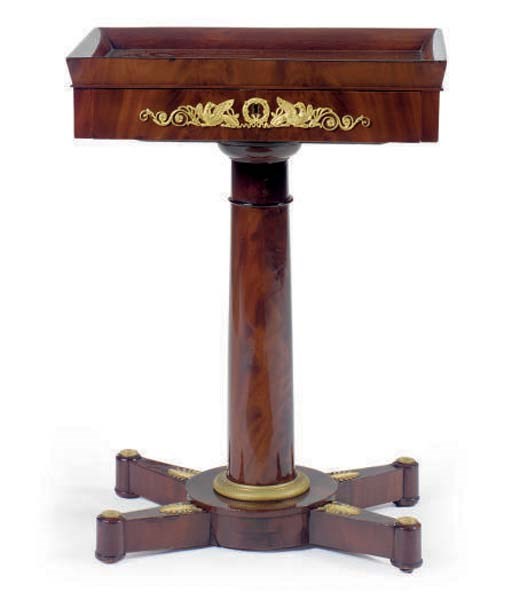 A FRENCH GILT-METAL MOUNTED MAHOGANY TABLE A OUVRAGE,