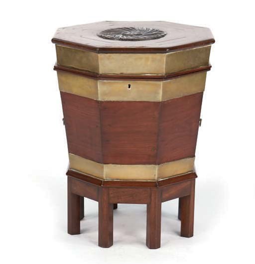 A GEORGE III OCTAGONAL FORM BRASS BOUND WINE COOLER ON LATER STAND,