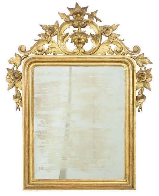 A CONTINENTAL CARVED GILTWOOD WALL MIRROR,
