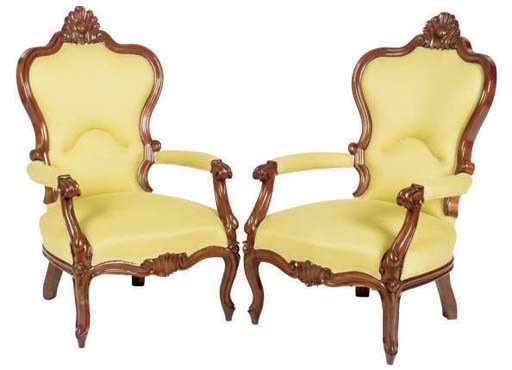 A PAIR OF VICTORIAN CARVED WALNUT ARMCHAIRS,