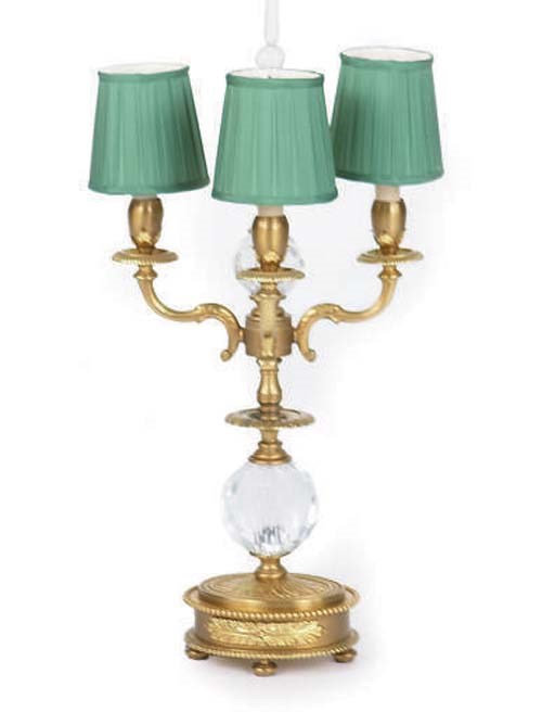 A FRENCH GILT-BRONZE AND CUT GLASS THREE BRANCH CANDELABRUM,