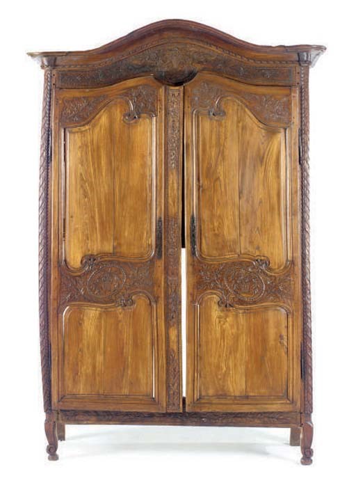 A LOUIS XV PROVINCIAL OAK AND WALNUT ARMOIRE,