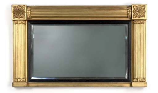AN AMERICAN EMPIRE GILTWOOD AND EBONISED MIRROR,