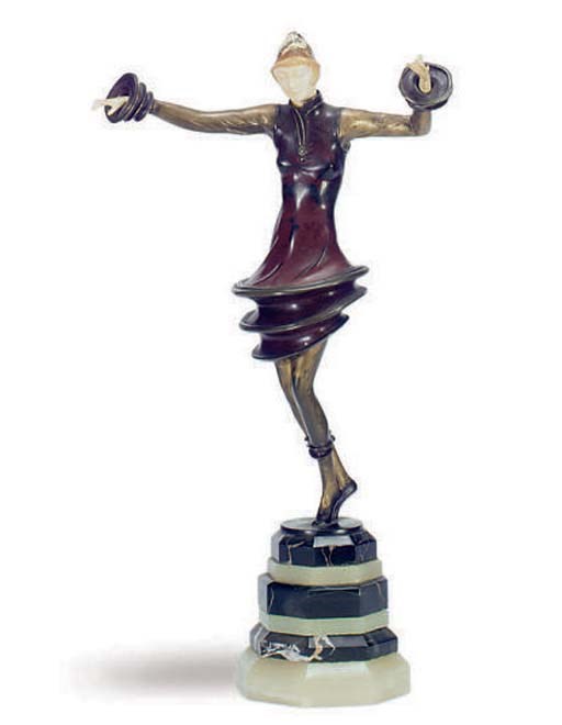 A COLD-PAINTED BRONZE AND IVORY FIGURE OF A DANCER**,