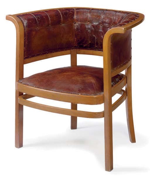 A LEATHER UPHOLSTERED BEECH ARMCHAIR,
