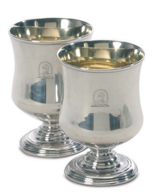 A PAIR OF SILVER FOOTED CUPS,