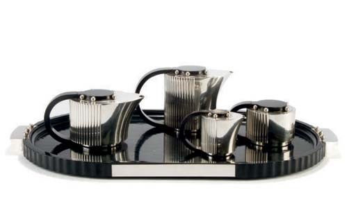 A FRENCH FOUR PIECE SILVER-PLATED AND EBONIZED WOOD TEA AND COFFEE SERVICE WITH TRAY,