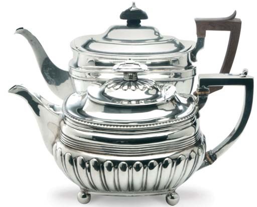 A GEORGE III SILVER TEAPOT WITH HINGED COVER AND A GEORGE V SILVER TEAPOT WITH HINGED COVER AND WOOD HANDLE,**