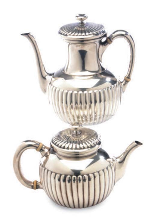 A FIVE-PIECE AMERICAN SILVER TEA AND COFFEE SET,**