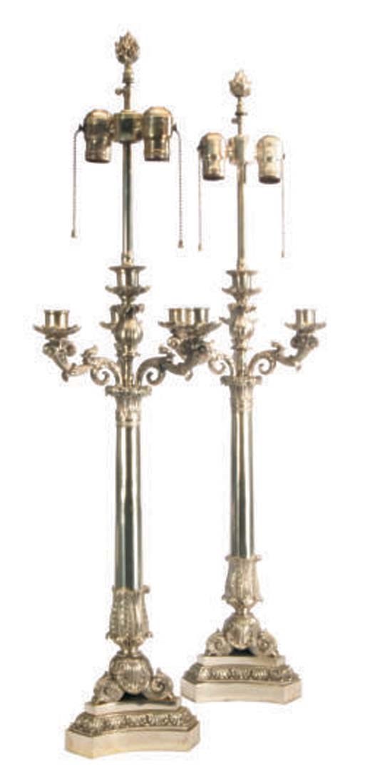 A PAIR OF SILVER-PLATED FOUR-LIGHT CANDELABRA MOUNTED AS LAMPS,