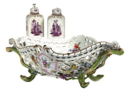 A GERMAN PORCELAIN RETICULATED BASKET AND A PAIR OF GERMAN PORCELAIN TEA CADDIES AND COVERS,