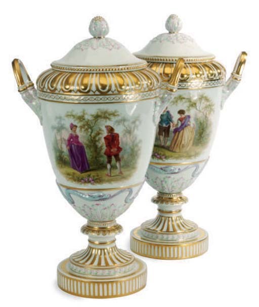 A PAIR OF GERMAN PORCELAIN TWO-HANDLED VASES AND COVERS,