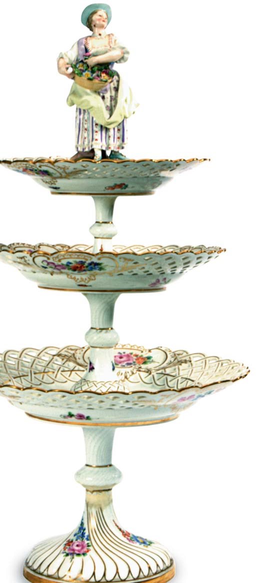 A GERMAN PORCELAIN RETICULATED THREE TIERED DESSERT STAND,