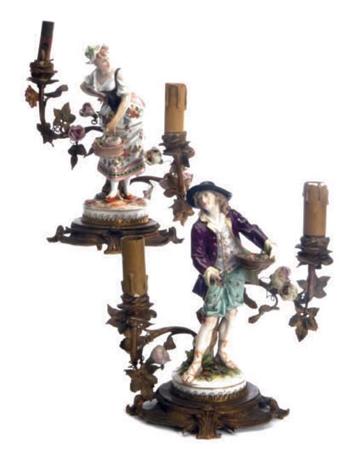 TWO GILT METAL AND MEISSEN STYLE PORCELAIN FIGURES OF A GARDENER AND GARDENER'S COMPANION MOUNTED AS FLOWER ENCRUSTED AND ELECTRIFIED CANDLEABRA,