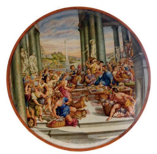 AN ITALIAN RENAISSANCE REVIVAL STYLE TIN-GLAZED EARTHENWARE CHARGER PAINTED WITH A FEAST SCENE,
