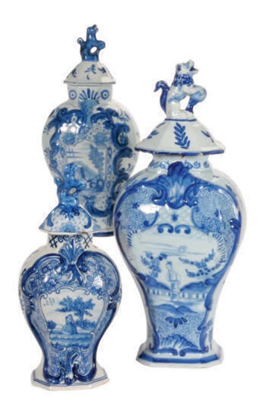 AN ASSEMBLED DUTCH DELFT GARNITURE OF FIVE BALUSTER VASES AND THREE COVERS,