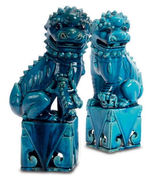 A PAIR OF CHINESE TURQUOISE GLAZED BUDDHISTIC LIONS,