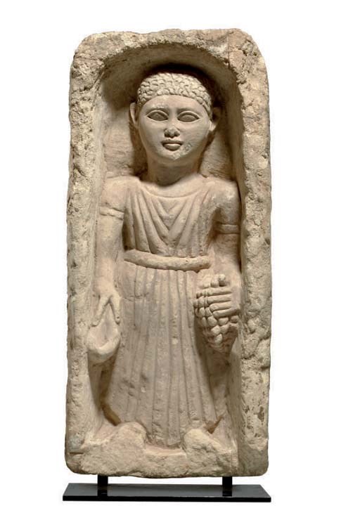 A EGYPTIAN LIMESTONE FUNERARY STELE,