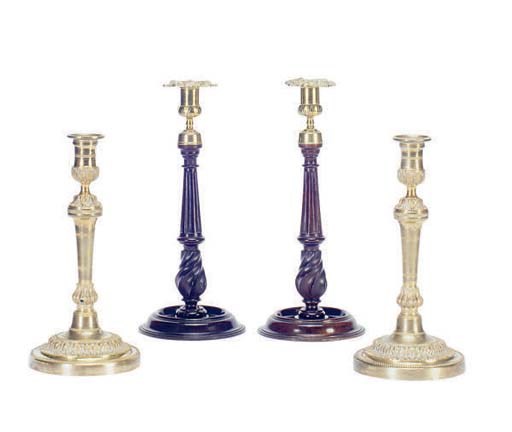 A PAIR OF BRASS MOUNTED TURNED MAHOGANY CANDLESTICKS AND PAIR OF GILT-BRONZE CANDLESTICKS,