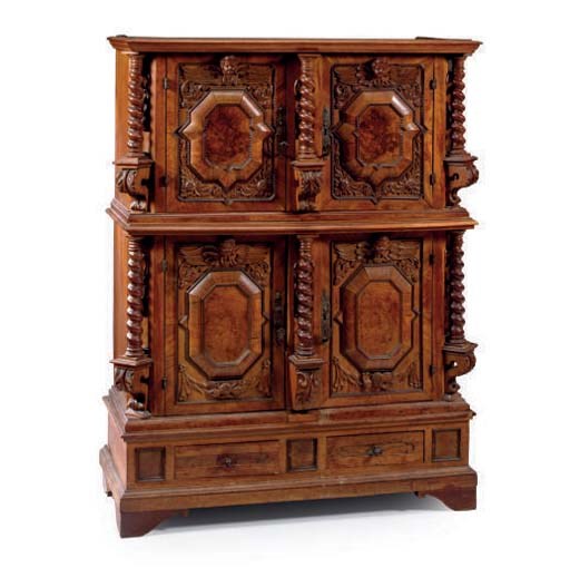 A NORTH GERMAN WALNUT AND EBONIZED CABINET,