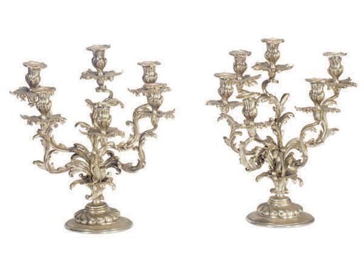A PAIR OF PARCEL-GILT AND SILVER BRONZE SIX-LIGHT CANDELABRA,