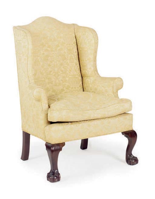 A MAHOGANY WINGBACK ARMCHAIR,