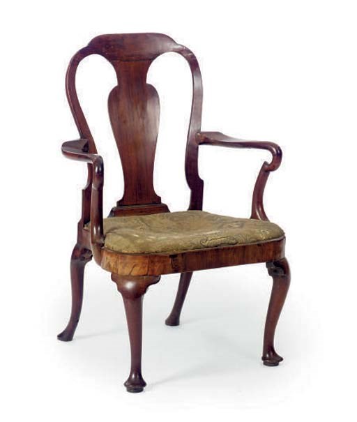 A GEORGE I CARVED WALNUT ARMCHAIR,