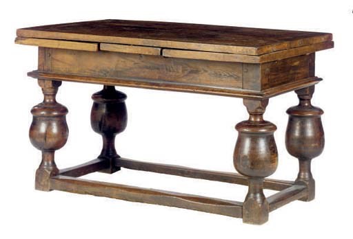 A CONTINENTAL OAK DRAW-LEAF TABLE,