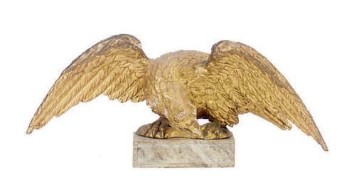 A CARVED GILTWOOD EAGLE,