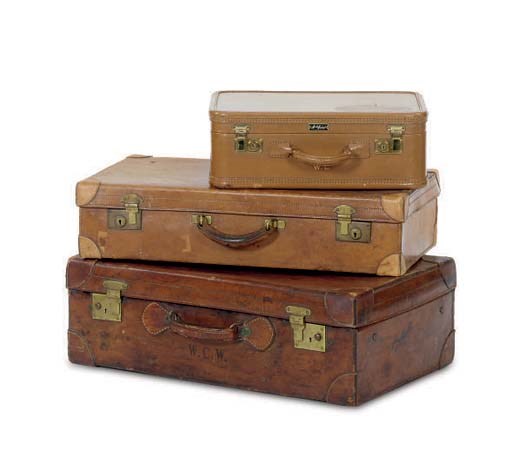 A GROUP OF THREE BROWN LEATHER SUITCASES,