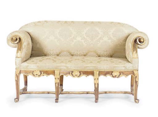 A NORTH ITALIAN PARCEL-GILT WALNUT SETTEE