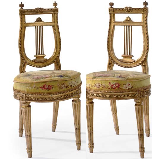 A PAIR OF LOUIS XVI GILTWOOD VOYEUSES