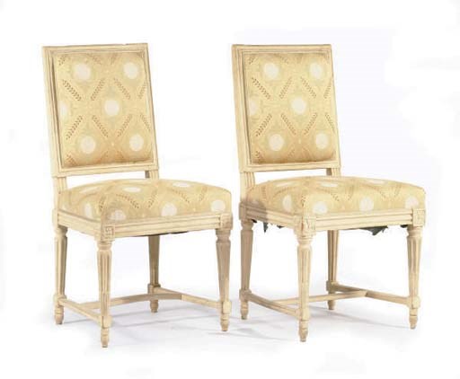 A SET OF FOUR CREAM-PAINTED AND PARCEL-GILT CHAISES,