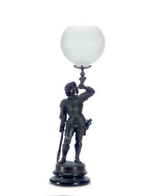 A BRONZE FIGURAL OIL LAMP WITH ETCHED GLASS GLOBE,