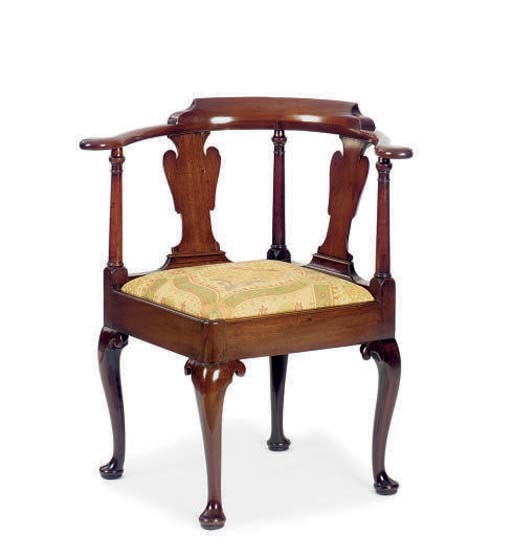A GEORGE II MAHOGANY CORNER ARMCHAIR,