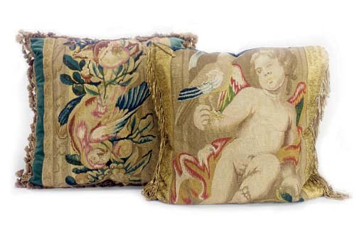 A GROUP OF EIGHT CUSHIONS,