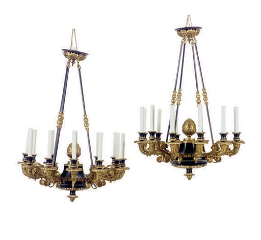 A PAIR OF PARCEL-GILT PATINATED METAL TWELVE-LIGHT CHANDELIERS,