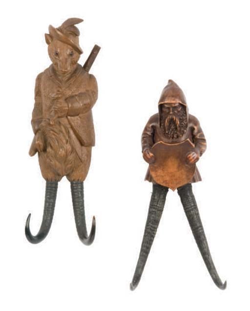 TWO BLACK FOREST CARVED FRUITWOOD AND HORN COAT RACKS,