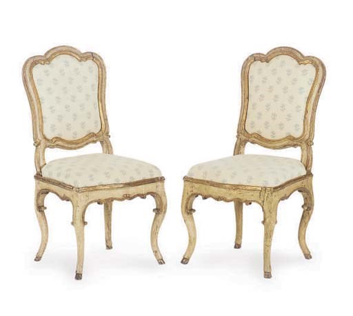FOUR ITALIAN PARCEL-GILT CREAM PAINTED DINING CHAIRS,