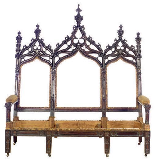 AN AMERICAN GOTHIC REVIVAL OAK SETTEE,