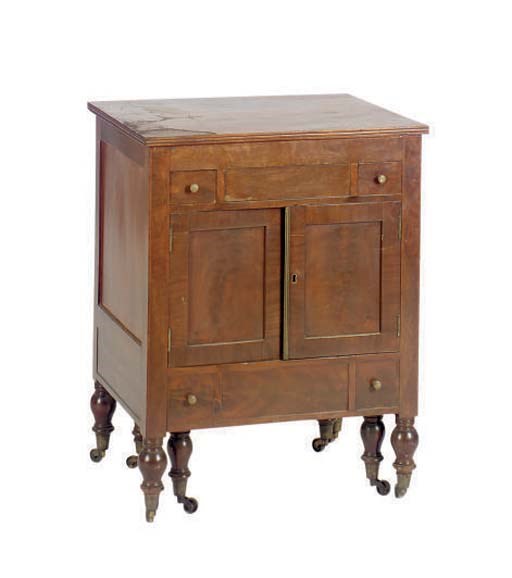A FRENCH RESTAURATION MAHOGANY DRESSING TABLE WITH LIFT-TOP AND FITTED BIDET,