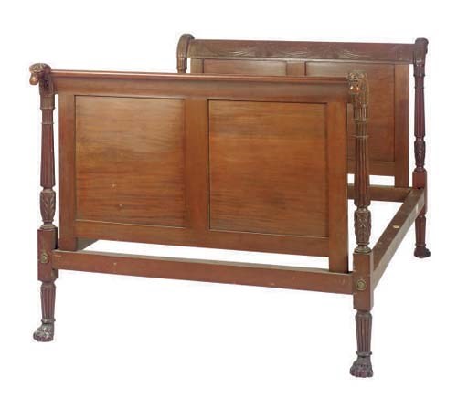 A CARVED MAHOGANY BED FRAME,