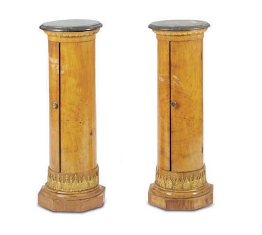 A PAIR OF BALTIC BIRCH PARCEL-GILT PEDESTALS WITH MARBLE TOPS,