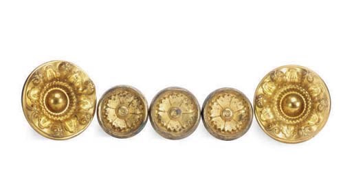 A GROUP OF SEVEN GILT-METAL CURTAIN TIE-BACKS,