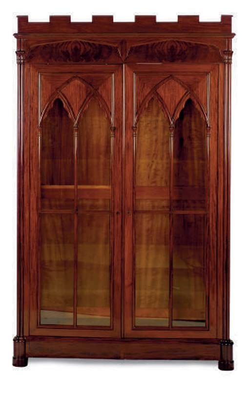 A PAIR OF AMERICAN GOTHIC REVIVAL MAHOGANY BOOKCASE CABINETS,