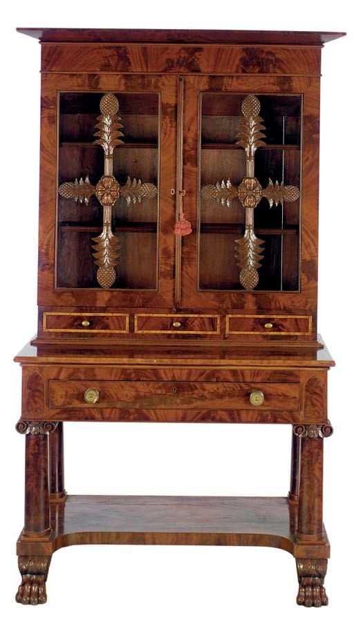 AN AMERICAN CLASSICAL FIGURED MAHOGANY BOOKCASE-ON-STAND,