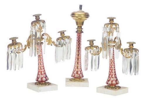 A PAIR OF GILT-METAL AND RUBY GLASS THREE-LIGHT CANDELABRA,