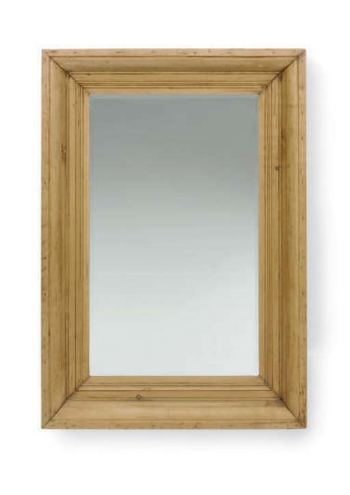 A PINE FRAMED BEVELED GLASS WALL MIRROR,